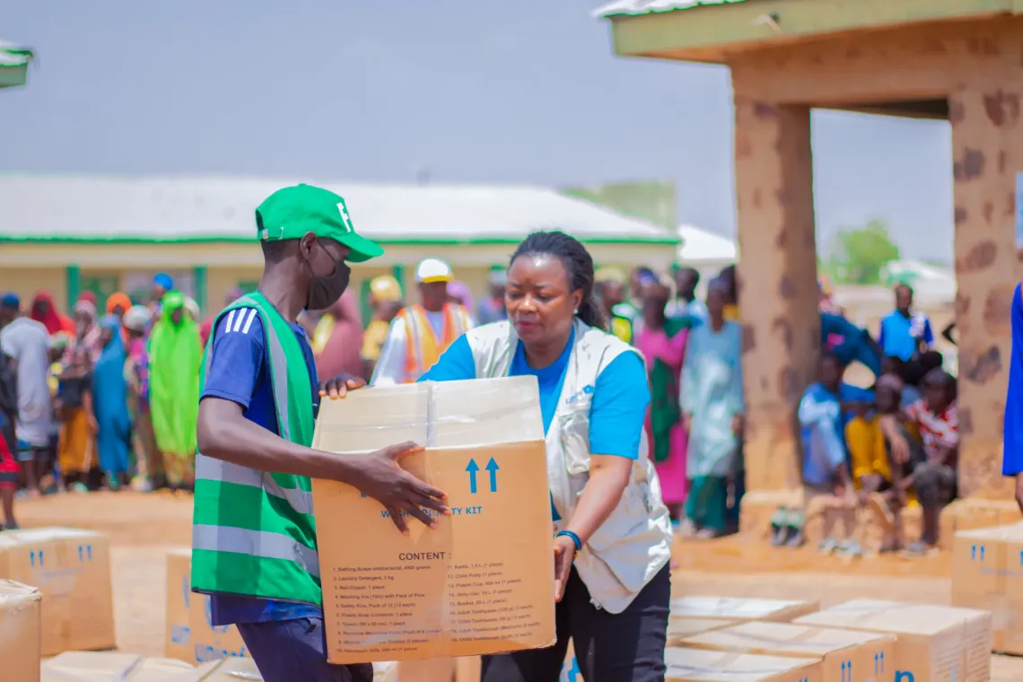 A woman distributing kts