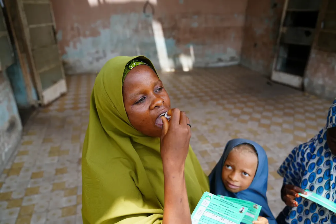 A woman receiving the oral vaccine