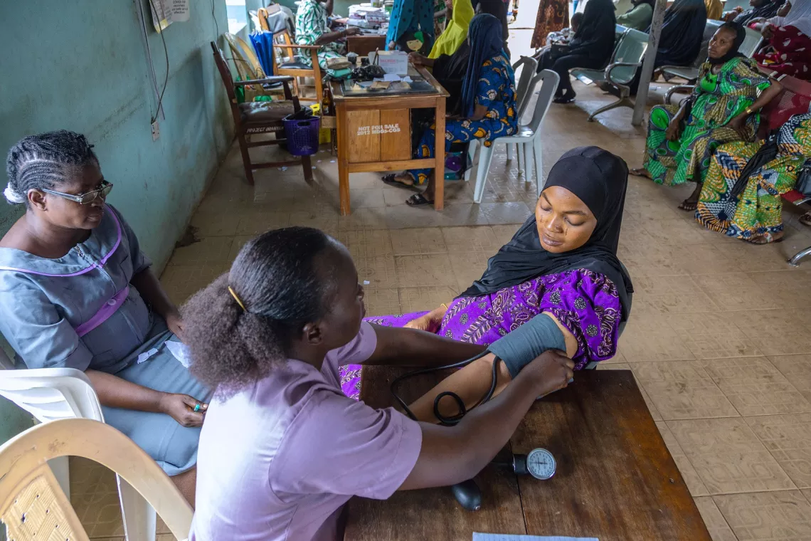 A pregnant women at antenatal care, checking blood pressure 