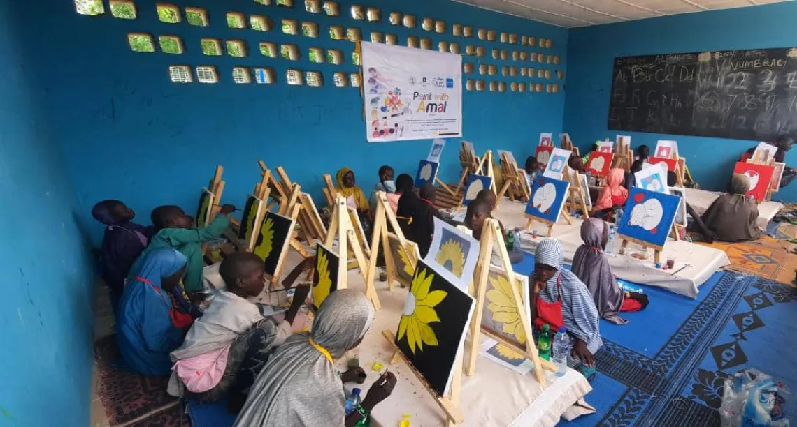 A group of children painting
