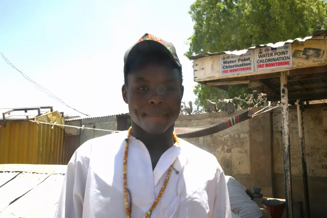 A boy looking at the camera. 