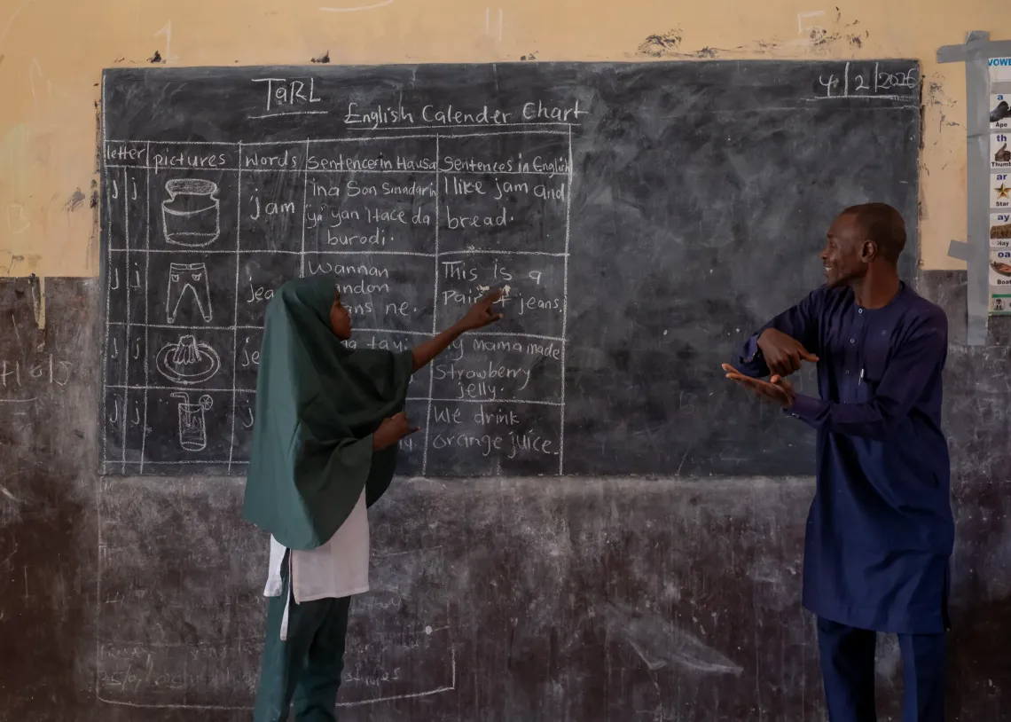 A girl in front of a classroom