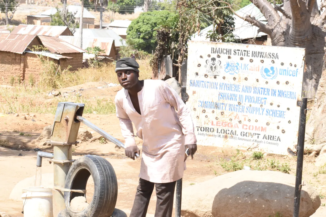 A man fetching water