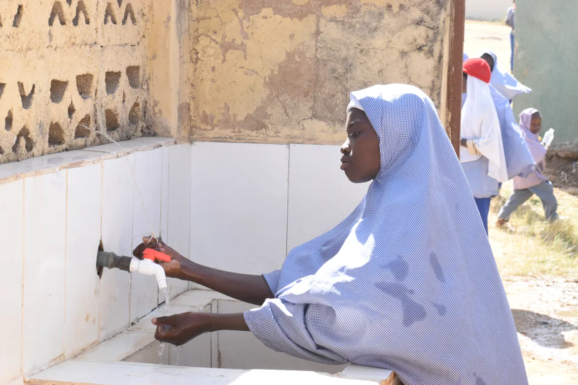 A girl washing her hands