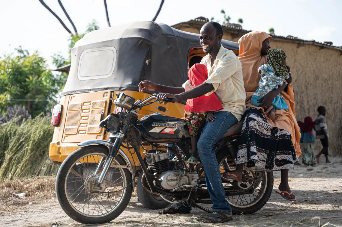A family on a motorcyle