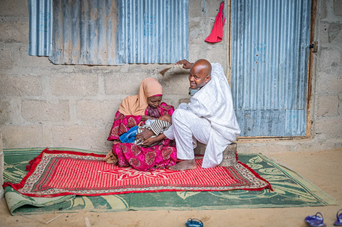 A man fanning his wife
