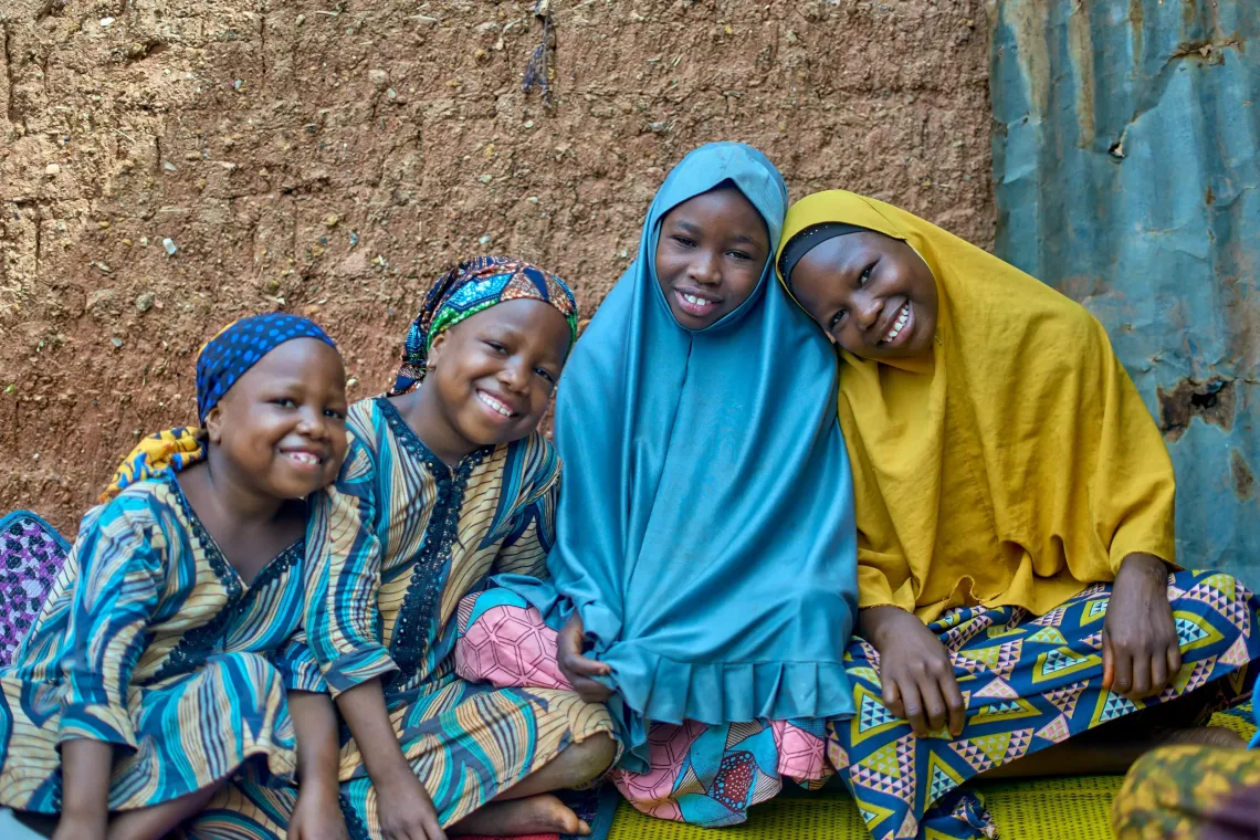 A family conversing in their home.