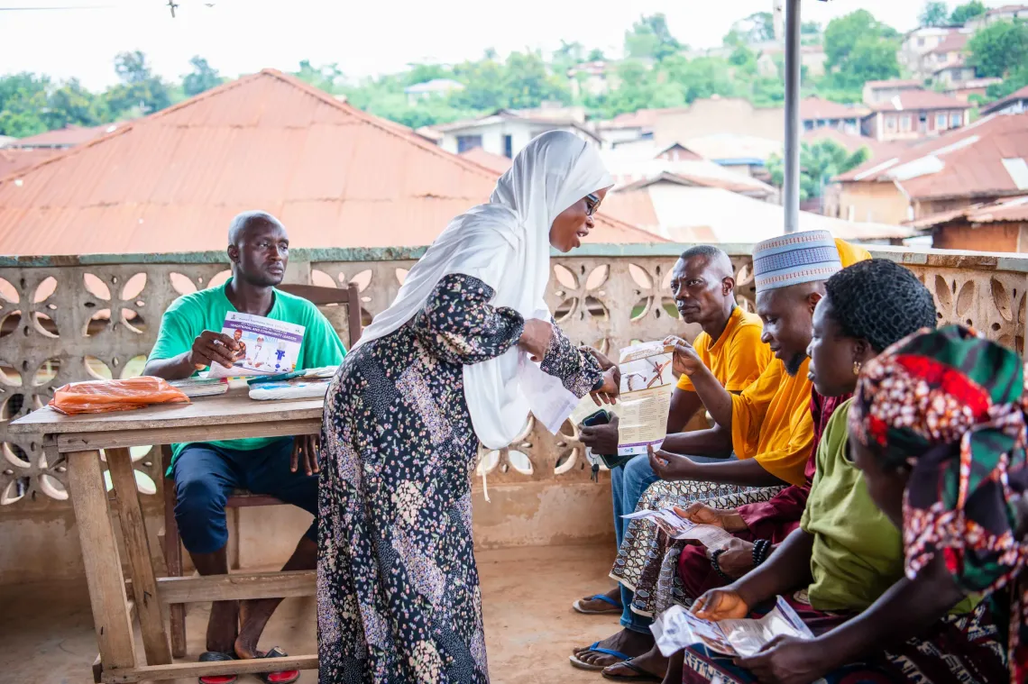 A health worker educating parents