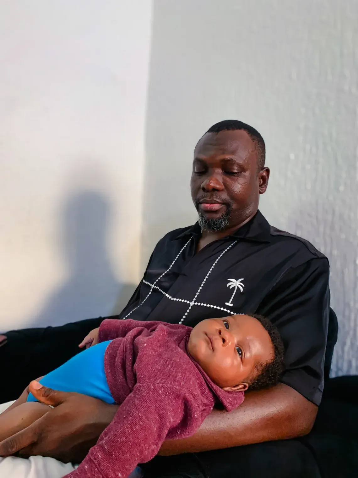 A father holding his baby