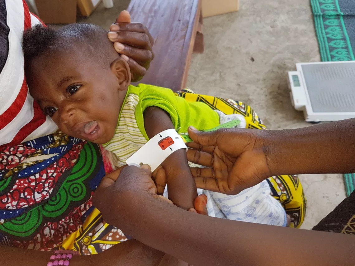 A child is being screened for malnutrition