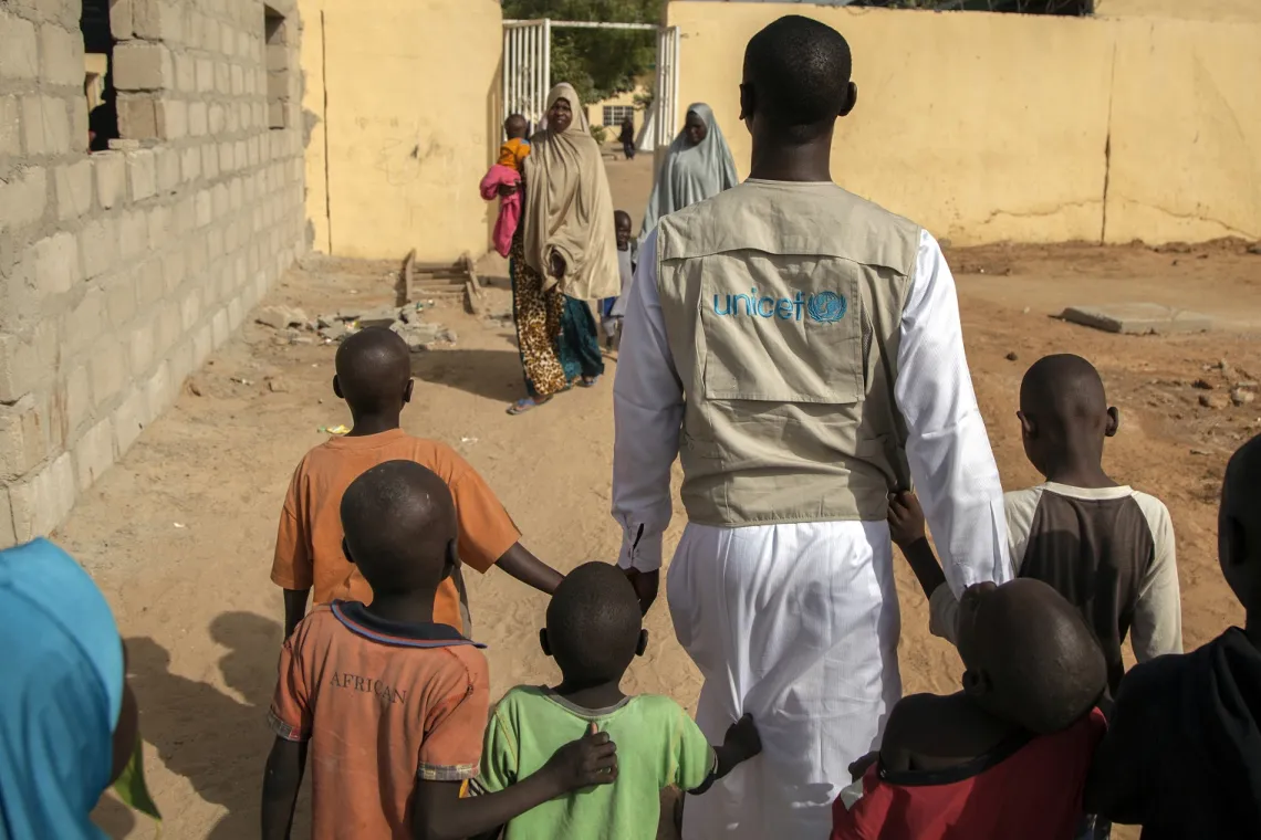 child-protection-officer-walking-with-children