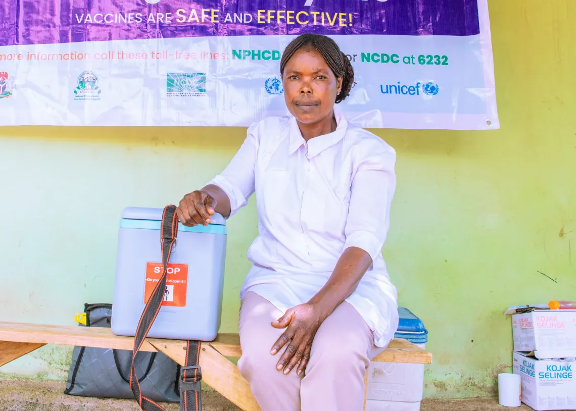 A health worker sitting 
