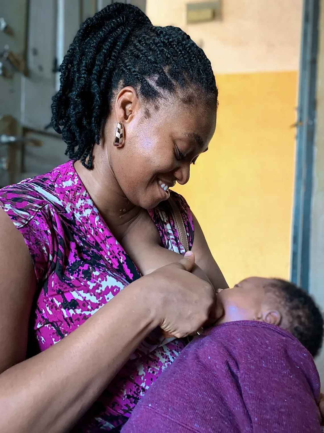 A mother breastfeeding her baby
