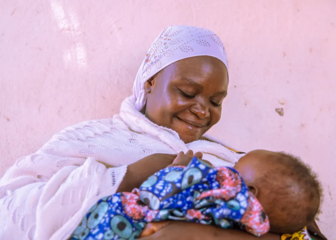 A mother breastfeeding her child