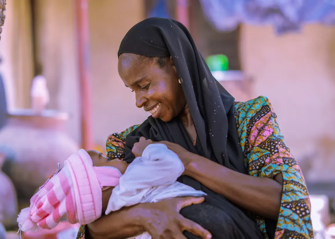 A mother breastfeeding her child