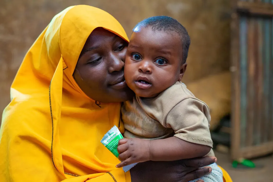 Hafsat Abdulrazak and her healthy looking son Ibrahim who has been receiving SQLNS treatment.