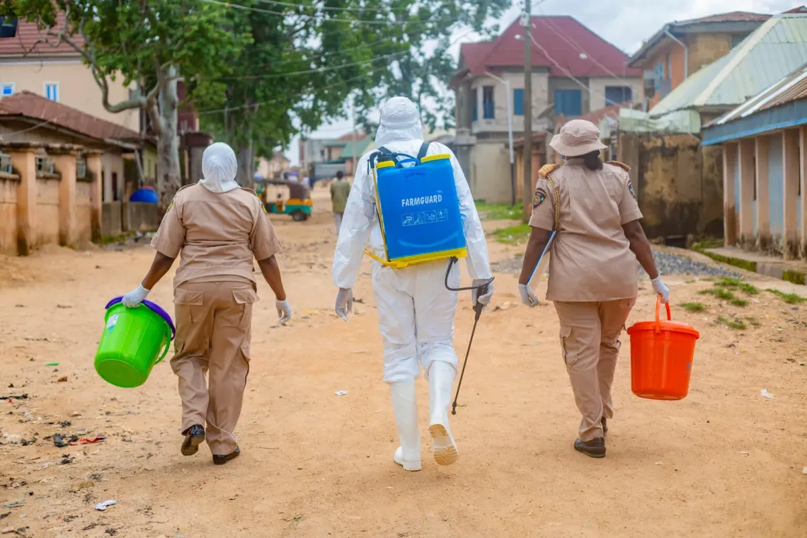 With support from UNICEF, Isa Mohammed, WASH Surveillance official leads the fumigation of affected communities during cholera outbreak response.