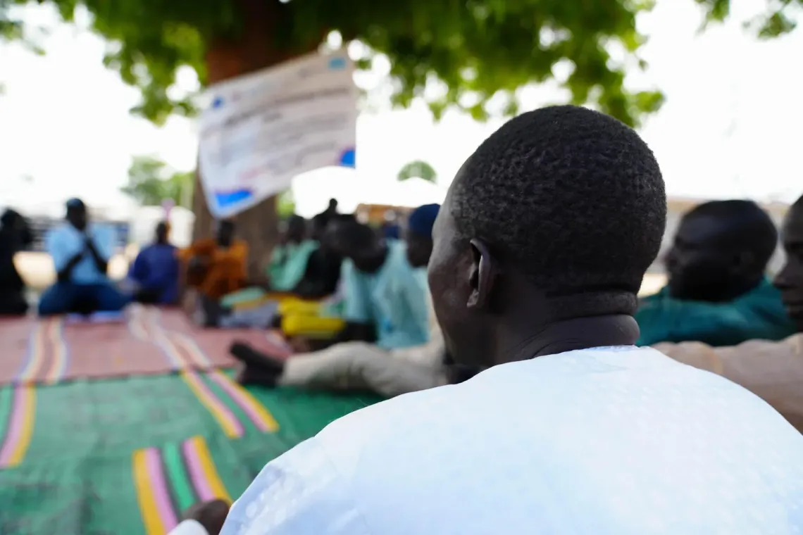 Mallam Ali, a member of the Engaging Men through Accountable Practice (EMAP) group, participates during a session at New Camp, Bama, Borno State.