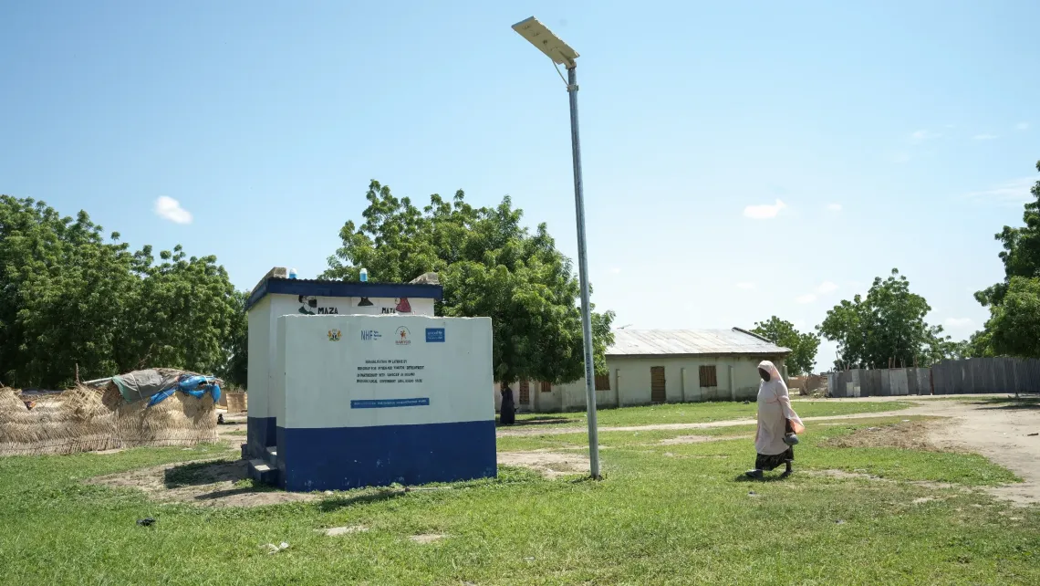 A woman going to a toilet