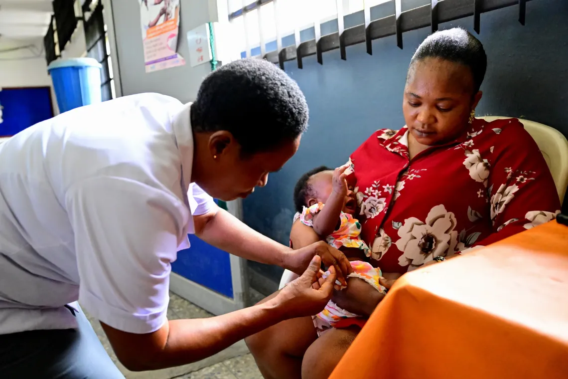 A woman with her vaccinated baby