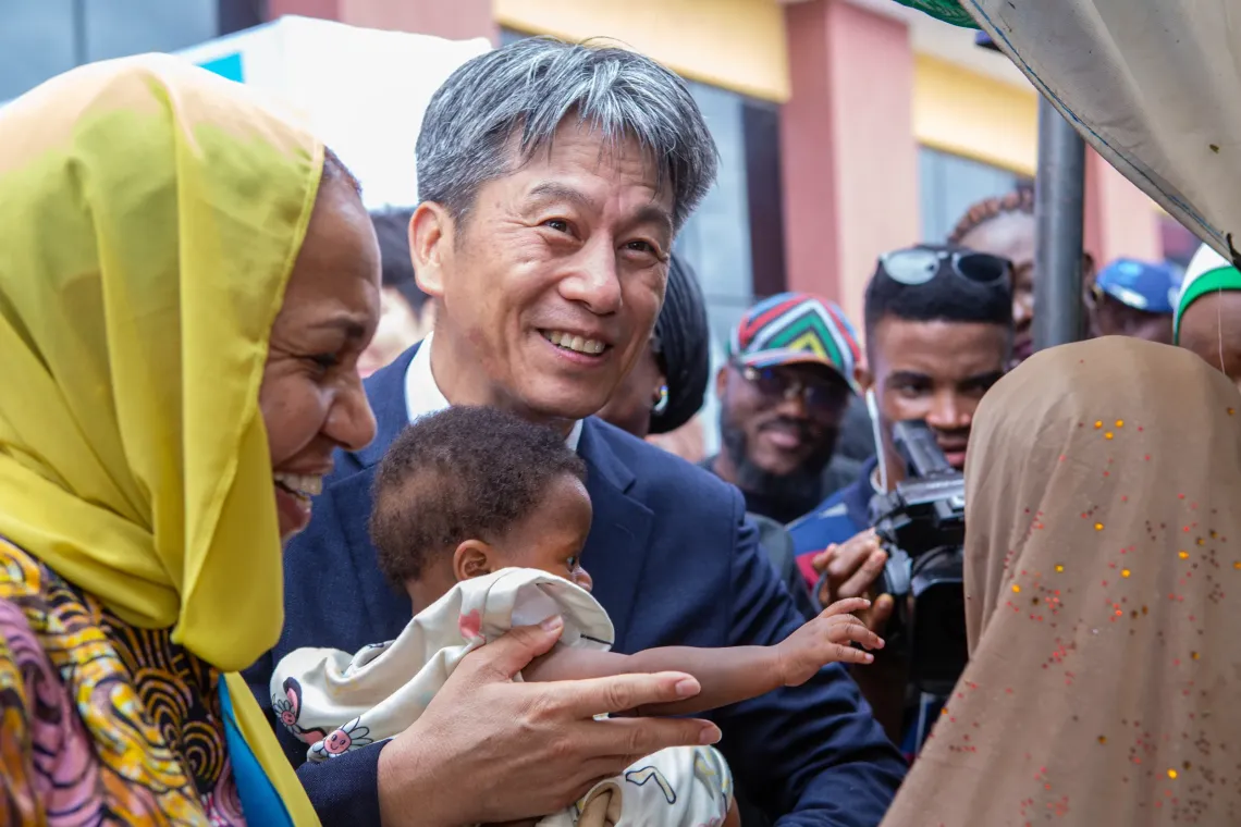 A man holding a baby