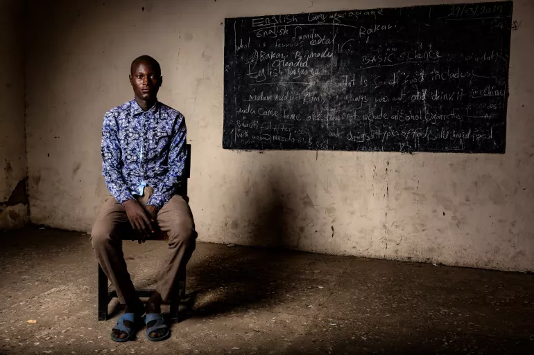 Teenage boy sitting in a classroom