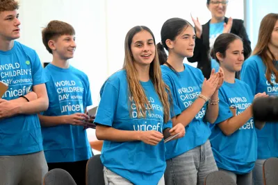 Adolescent boys and girls smiling at camera