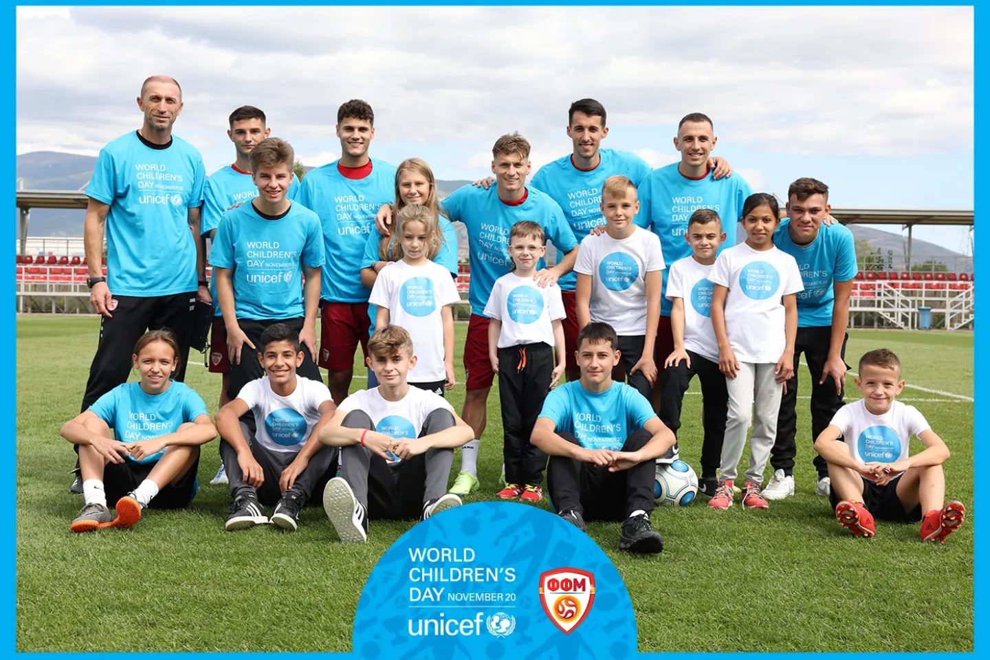 National football team and children wearing blue t-shirts 