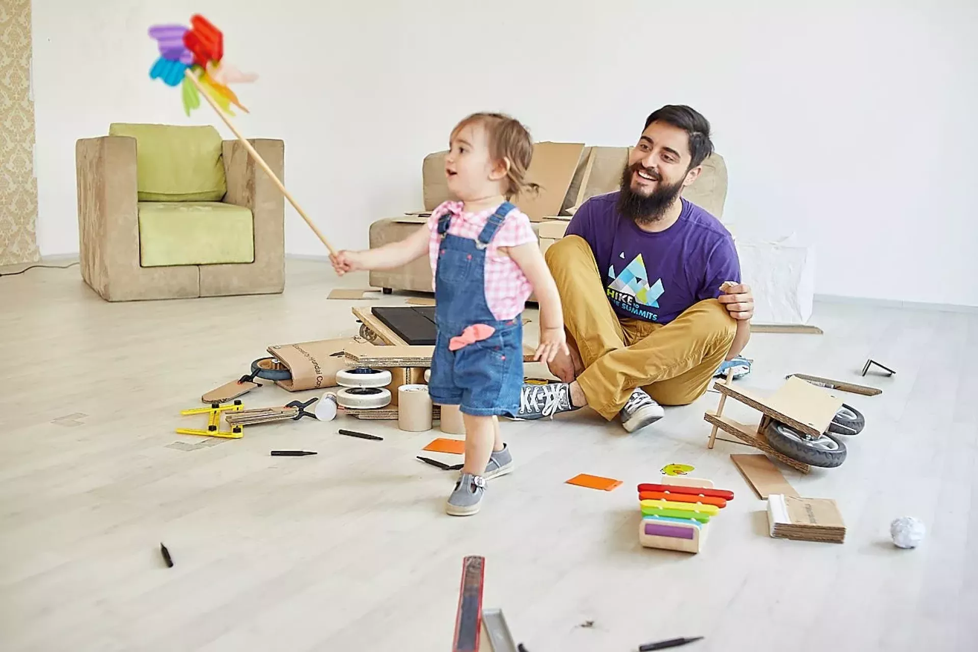 Father playing with child indoors