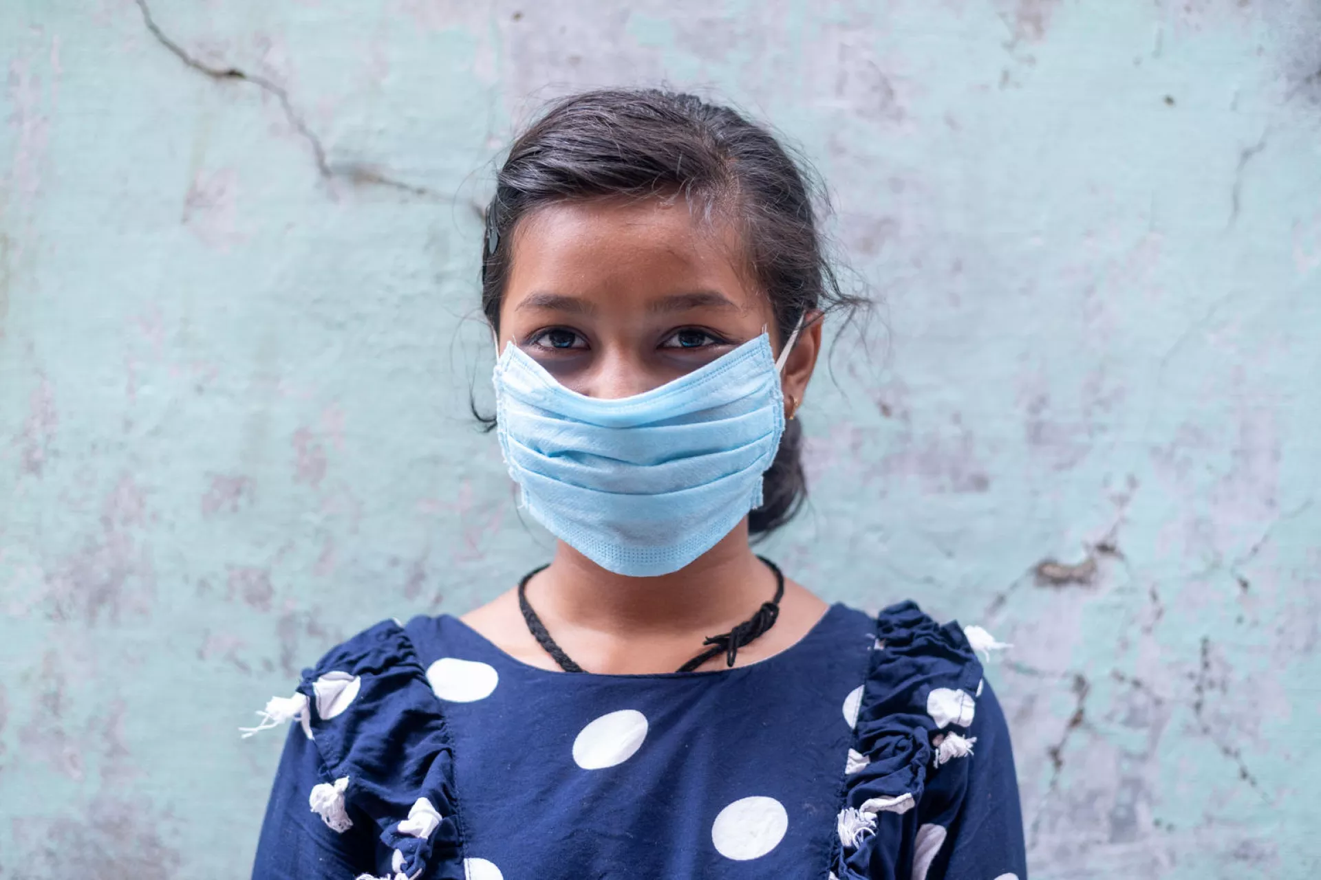 A girl wearing a mask