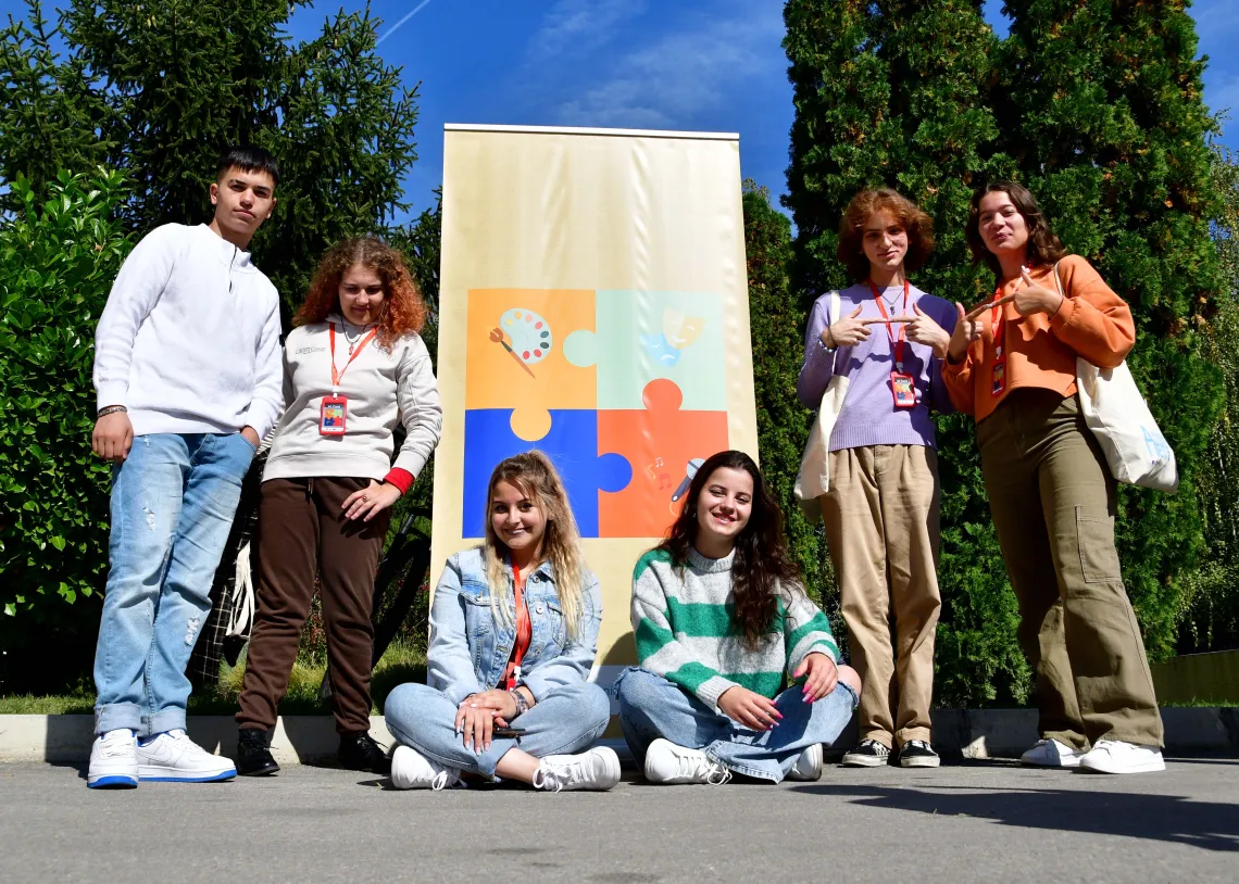 Team Student Clubs in front of the banner they designed as part of their participation in UNICEF initiative Youth Advocates for Justice for Children. 