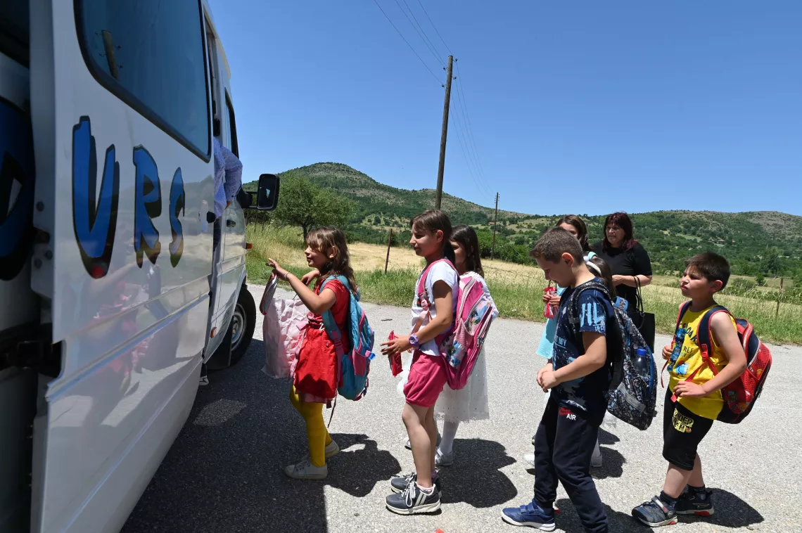 Group of children waiting in line to get in a bus, UNICEF North Macedonia