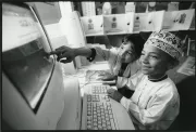 School Children working on a computer