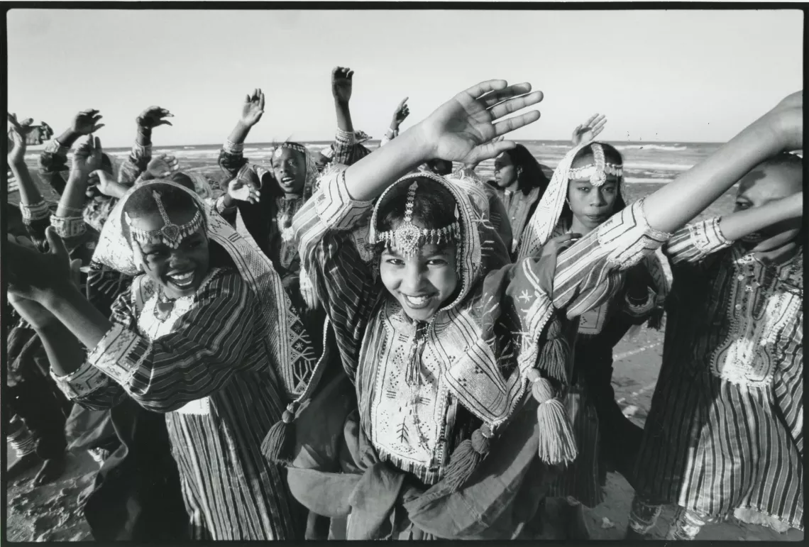 Girls wearing traditional attire performing a dance