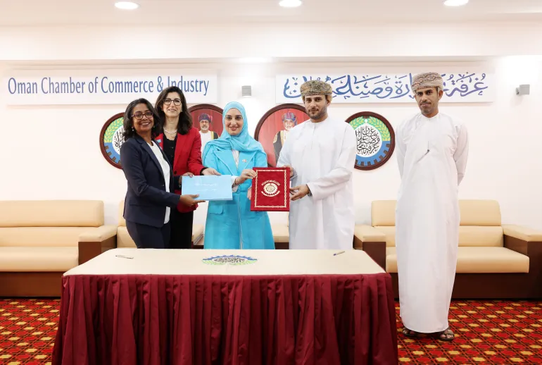 OCCI and UNICEF holding the signed agreement 