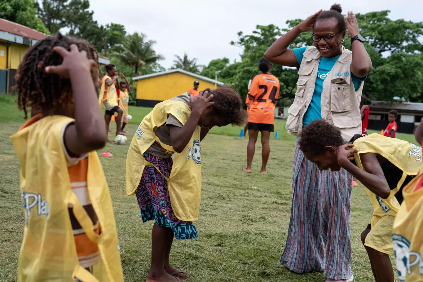 UNICEF Vanuatu Child Protection specialist Rebecca with fascilitators conducting play-based PSS activities with children from Erakor Village after the Earthquake. Erakor Village, Efate, SHEFA, Vanuatu