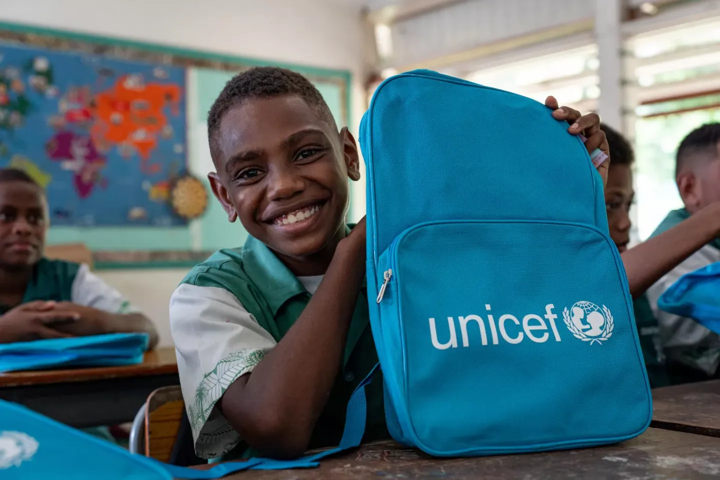 Students of Central School, Port Vila, with their backpacks on the second day of school. These backpacks were distributed by UNICEF staff to children affected by the recent earthquake.