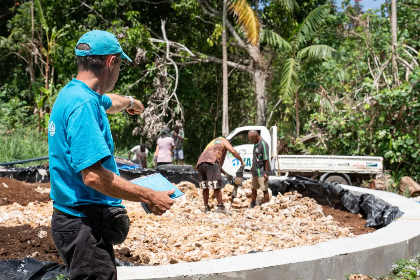 Brecht Mommen, WASH Specialist at UNICEF Vanuatu, on the construction site of the new water tank in Mele Village. This 300,000L water tank will replace the previous one that was damaged during the earthquake.