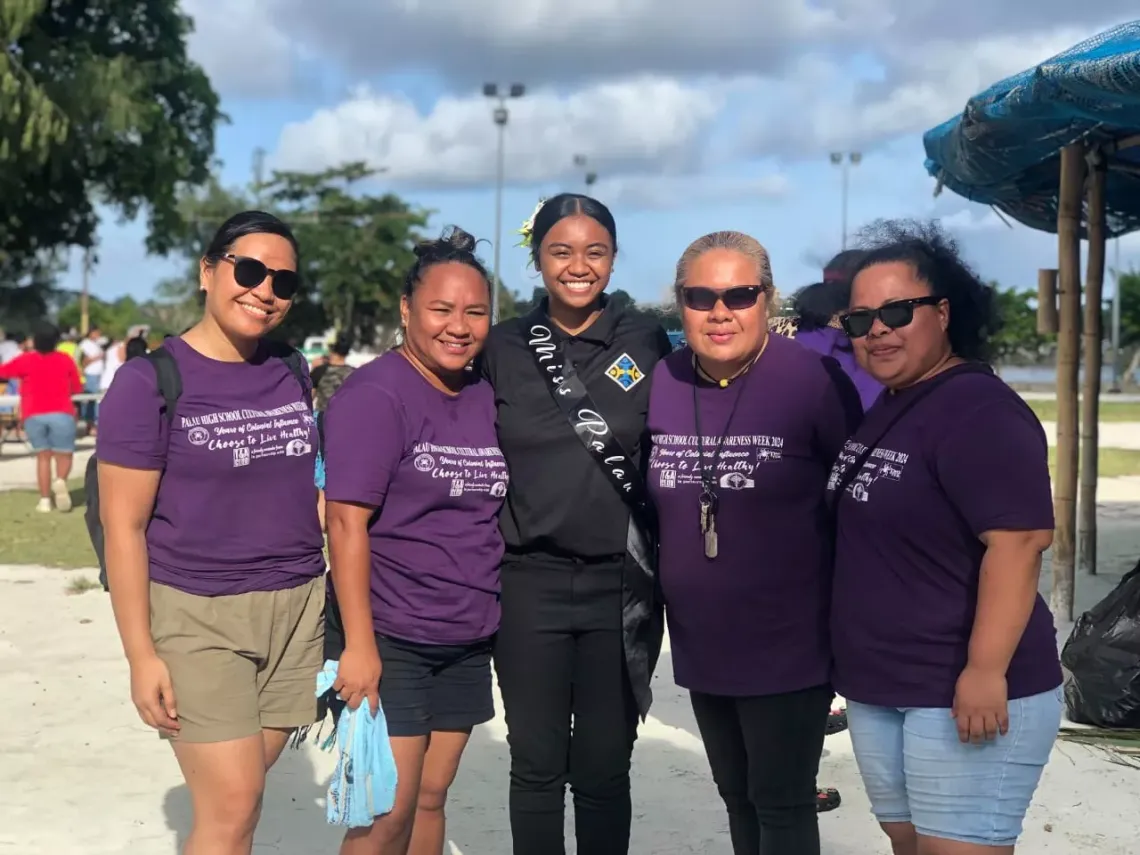 Dee-Raya Antonio (centre) with staff of Palau High School as part of their cultural awareness week 