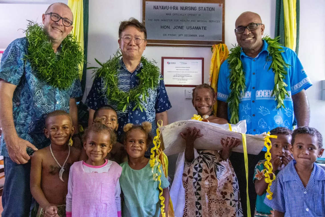[From left] UNICEF Pacific Representative, Mr. Jonathan Veitch; Korean Ambassador to Fiji, H.E. Jin-Hyung Kim; and the Minister for Health and Medical Services, Hon. Dr. Ratu Atonio Rabici Lalabalavu with children at the Nayavuira Nursing Station.