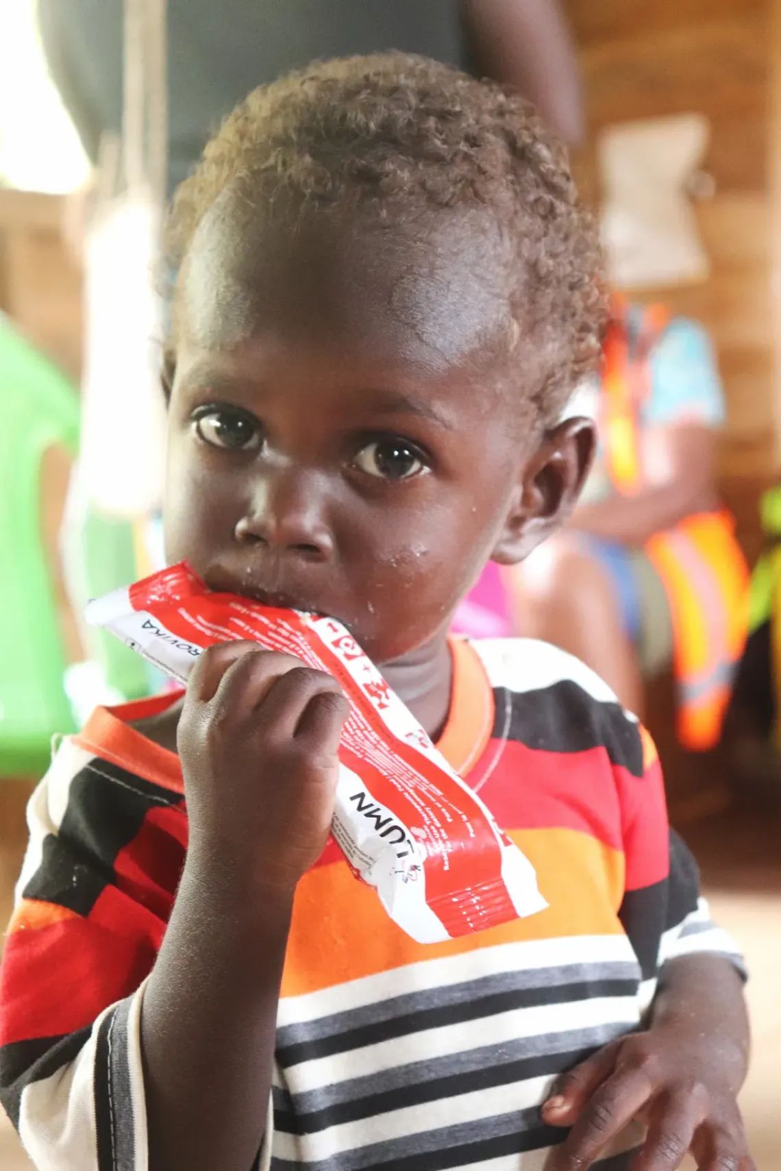 Three-year-old Douglas feeds on life-saving therapeutic food distributed as part of UNICEF-supported nutrition interventions in Western Province. Following the cyclone, destroyed food gardens and dwindling supplies have increased the risk of malnutrition for young children and vulnerable families. 