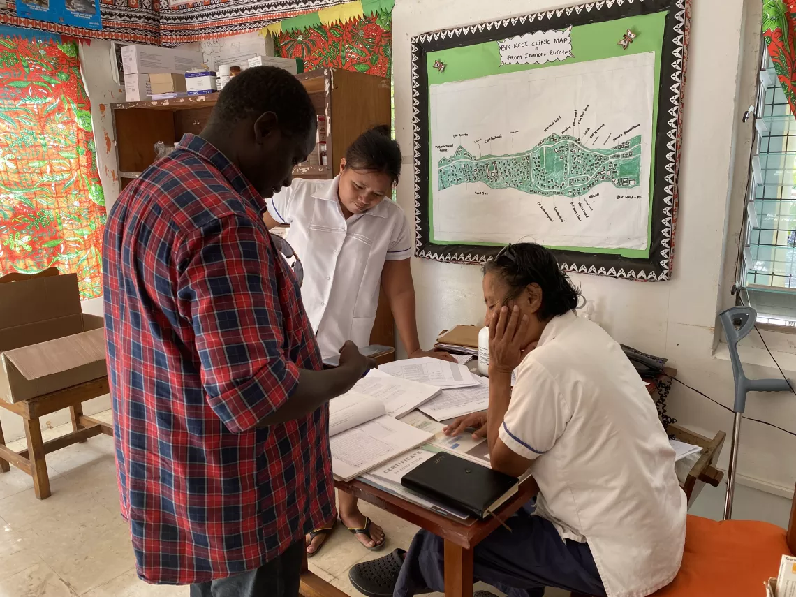 Ibrahim shares some of his expertise with local healthcare workers on vaccination processes.