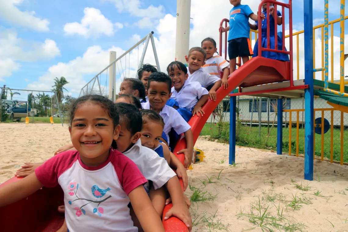 Children playing in playground.