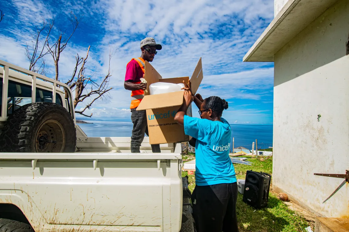 Sandrine, UNICEF WASH officer unloads UNICEF- WASH supplies for Emergency Medical Operation Center in Melsisi.