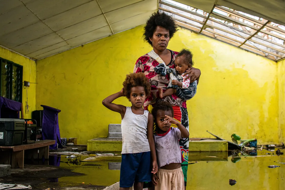 Bernadeth and her three children took shelter in this church house that lost parts of its roof and was flooded. 