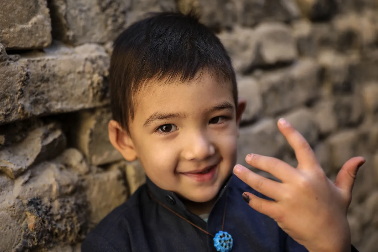 A child shows his finger marked with ink after having been vaccinated against the deadly measles virus in Pakistan.