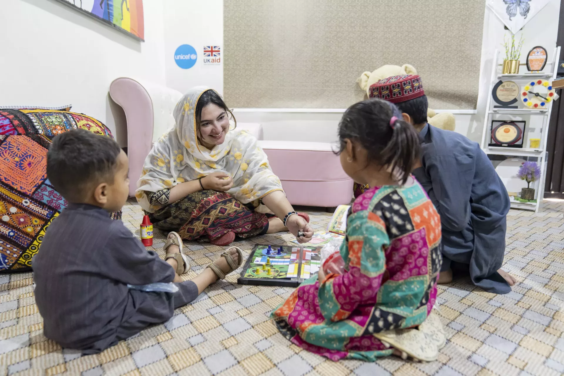Psychologist Maria Sultan plays with children in the Counselling Room at the Child Protection Unit in Mingora, Swat District, Khyber Pakhtunkhwa. 