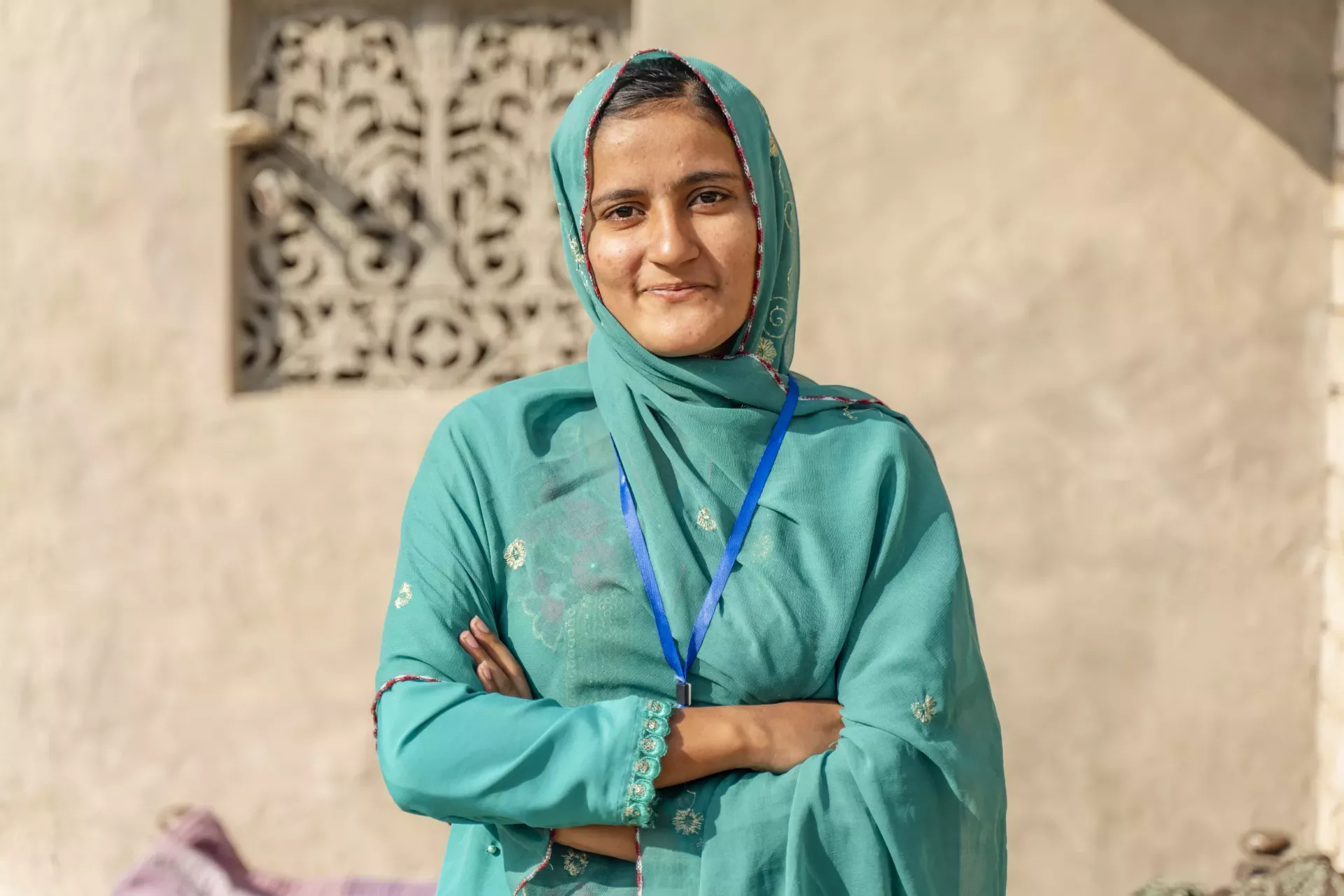 Ayatul Naz (19) standing outside her home