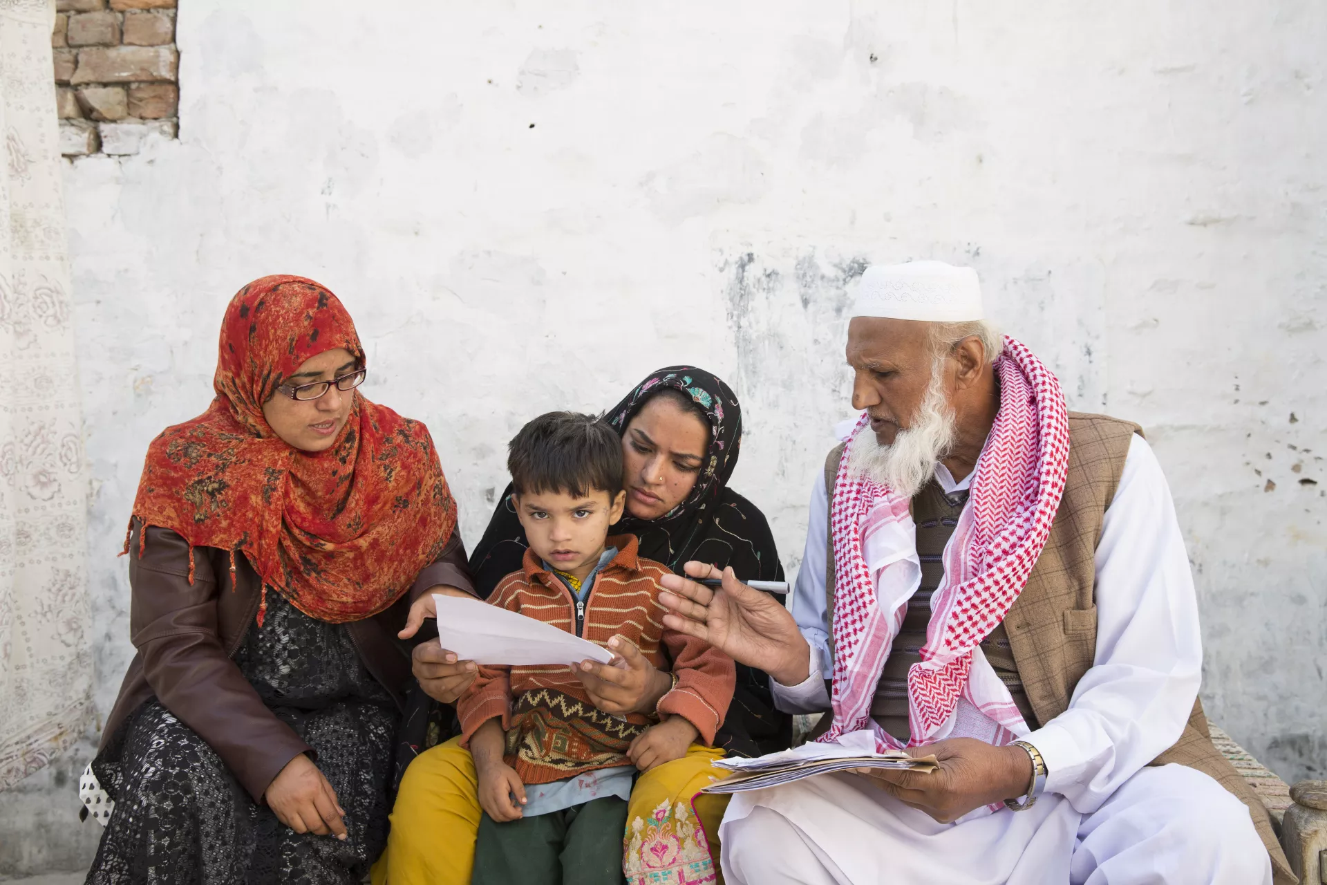 A mother is getting the digital birth registration of her son 