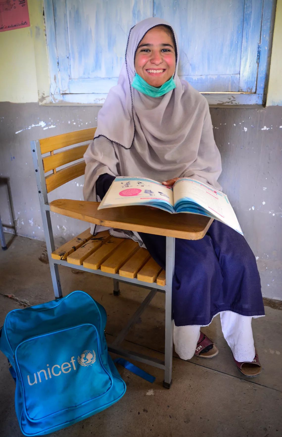 A girl is shown reading her book in a classroom in the Hangu area of the Khyber-Pakhtunkhwa province in Pakistan.